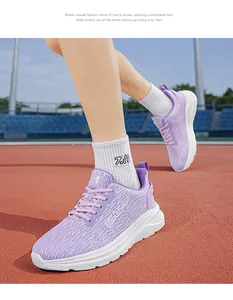Detailed action shot of purple lightweight marathon running shoes on a sports track