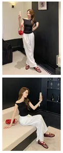 Elegant dark red rhinestone mesh Mary Jane flats with hollow-out design shown on model.