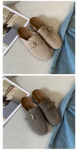 Detail view of suede mule slippers with vintage buckle strap in tan and taupe colors