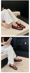 Breathable burgundy mesh Mary Jane flats with rhinestones on foot lifestyle view