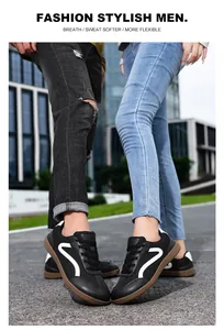 Detail of black leather breathable men's casual sneakers on outdoor city street.