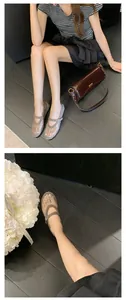 Close-up of elegant rhinestone mesh Mary Jane shoes worn with casual chic outfit