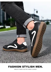 Close-up of black leather GAT sneakers for men, featuring a stylish gum sole and white accents.
