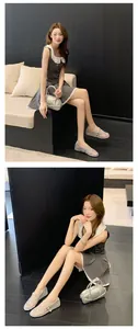 Elegant silver mesh Mary Jane shoes with rhinestones shown in a lifestyle indoor setting.