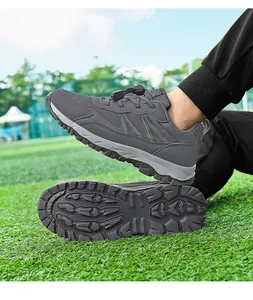 Detailed view of grey breathable athletic shoe showing non-slip rubber sole and mesh upper