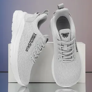 Lightweight light grey marathon running shoes with breathable mesh and lace-up design