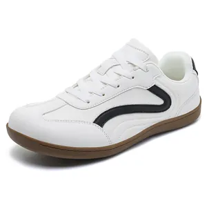 Professional white leather German training sneakers for men with brown gum sole and wavy design