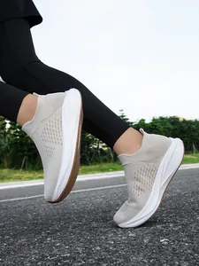 Action shot of breathable mesh slip-on sneakers on a road for walking or running