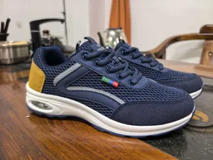 Detailed view of navy blue mesh breathable air cushion sneakers for men