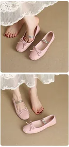 Detailed close-up of pink Mary Jane ballet flats with bow and elastic strap worn by a model.