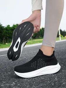 Detail view of breathable slip-on walking shoes with a focus on the anti-slip outer sole.