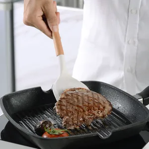 Spatule professionnelle en silicone blanc avec manche en bois pour griller steak