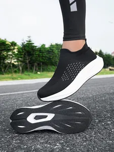 Detailed macro view of breathable mesh upper and textured outsole of slip-on casual sneakers