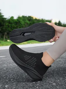 Lightweight black breathable knit sneakers with anti-slip thick sole design detail