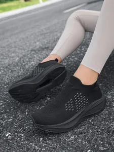 Detail view of lightweight breathable black mesh slip-on walking shoes for outdoors