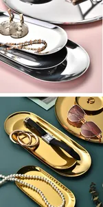 Professional display of oval gold and silver stainless steel trays with jewelry