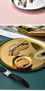 Elegant gold-plated stainless steel round tray organizing luxury jewelry and accessories