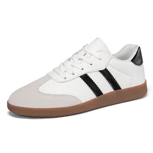 White and grey German trainer casual sneakers with gum sole and black stripes design