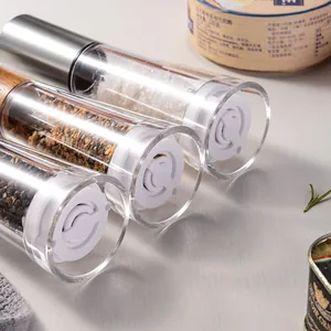 Premium manual acrylic and stainless steel spice grinders with wooden accents for salt and pepper