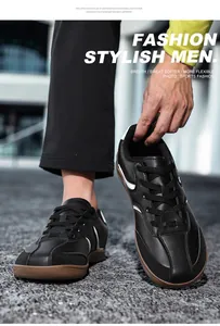 Dettaglio ravvicinato di sneakers GAT in pelle nera con suola in gomma marrone per uomo