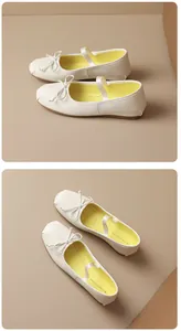 Detailed macro view of white French Mary Jane ballet flats with decorative bow