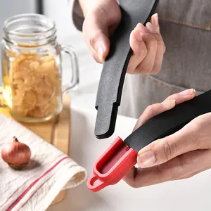 3-in-1 silicone kitchen tongs for steak and frying, shown being held in a kitchen setting.