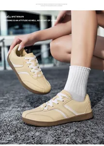 Vista dettagliata delle sneakers da allenamento tedesche in pelle gialla con lacci bianchi