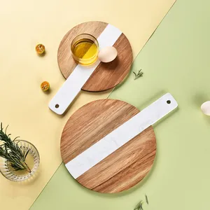 Elegant marble and acacia wood spliced round cutting board for steak and food serving