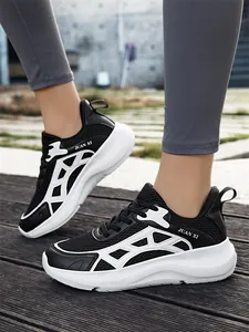 Close-up view of black and white breathable mesh running shoes with lightweight thick soles