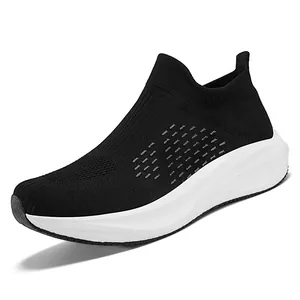 Breathable black knit slip-on sneakers with a lightweight white sole for men and women.