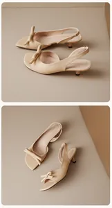 Λεπτομερής προβολή των μπεζ slingback πέδιλων με φιόγκο και τακούνι kitten heel