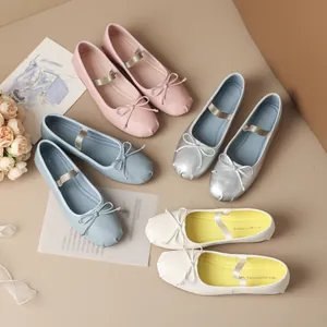 Elegant French-style ballet flats with bow and elastic strap in multiple colors.