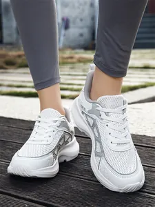 Macro view of breathable white mesh material on lightweight men's casual sneakers