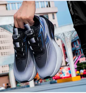 Close-up of lightweight gradient grey running shoes with blue accents and thick white soles
