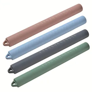 Set of four colorful silicone rolling pins with scale markings for baking
