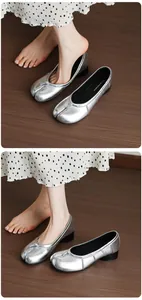 Detailed view of women's silver metallic split-toe ballet flats with comfortable block heels