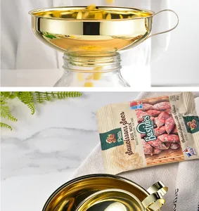 Detail showing the golden mirror finish of the stainless steel funnel set for kitchen use.