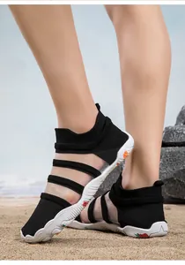 Detailed view of black breathable water shoes for beach and diving activities.