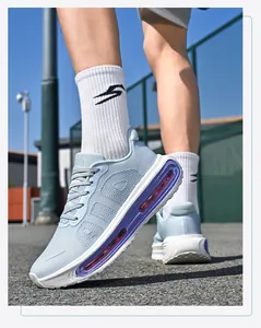 Detailed low-angle view of breathable light blue mesh air cushion running sneakers