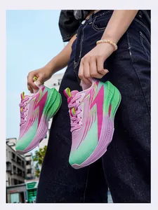 Vibrant pink and green lightweight running shoes with mesh upper and thick cushioned sole