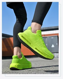 Vibrant neon green air cushion mesh running shoes shown in an outdoor sports setting.