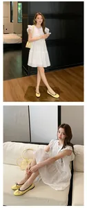 Nahaufnahme der eleganten gelben Ballerinas mit Schleife an Model im weißen Kleid