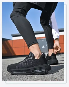 Close-up of black mesh running shoes featuring thick air cushion soles and AIR branding