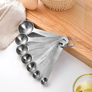 Professional 7-piece stainless steel measuring spoons set for baking with clear scale markings