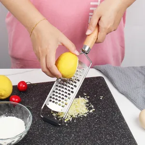 Handheld stainless steel cheese grater and lemon zester with ergonomic wooden handle
