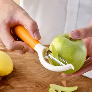 Éplucheur de fruits ergonomique en acier inoxydable en forme de Y avec manche orange