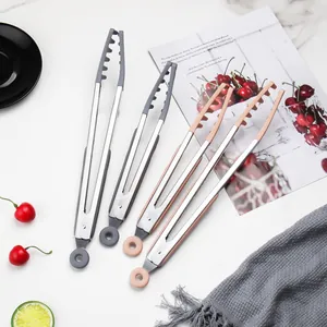 Professional heat-resistant stainless steel kitchen tongs with silicone tips for cooking