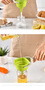 Handheld green collapsible silicone funnel used for pouring oil and salt into glass jars