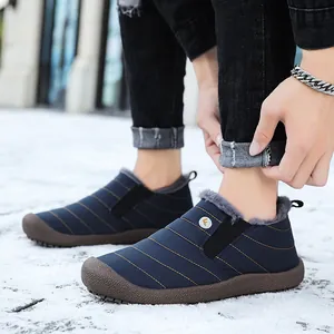 Men's warm fleece-lined slip-on snow boots for outdoor winter wear in snowy scenery