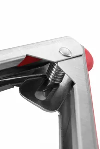 Close-up of the durable high-elasticity spring mechanism on stainless steel kitchen tongs